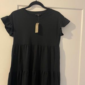 Never worn, tag still on (RUNS BIGGER THAN SIZE)